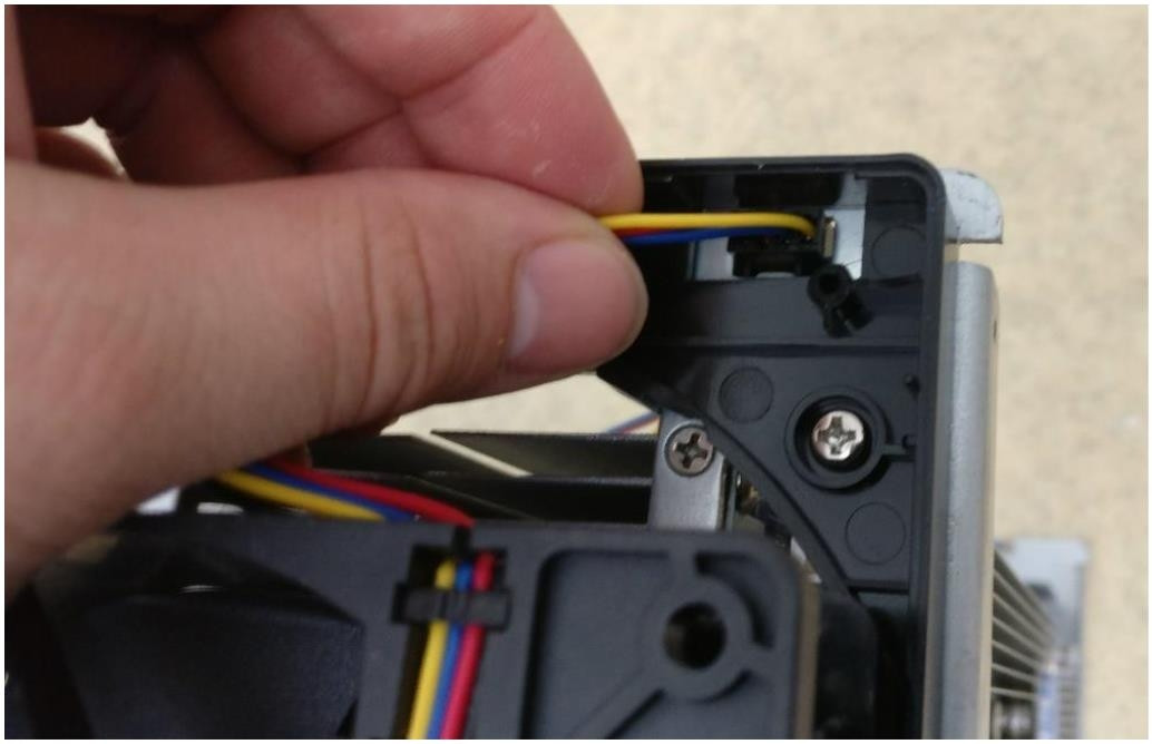 Unplugging the 4-pin fan cable connector